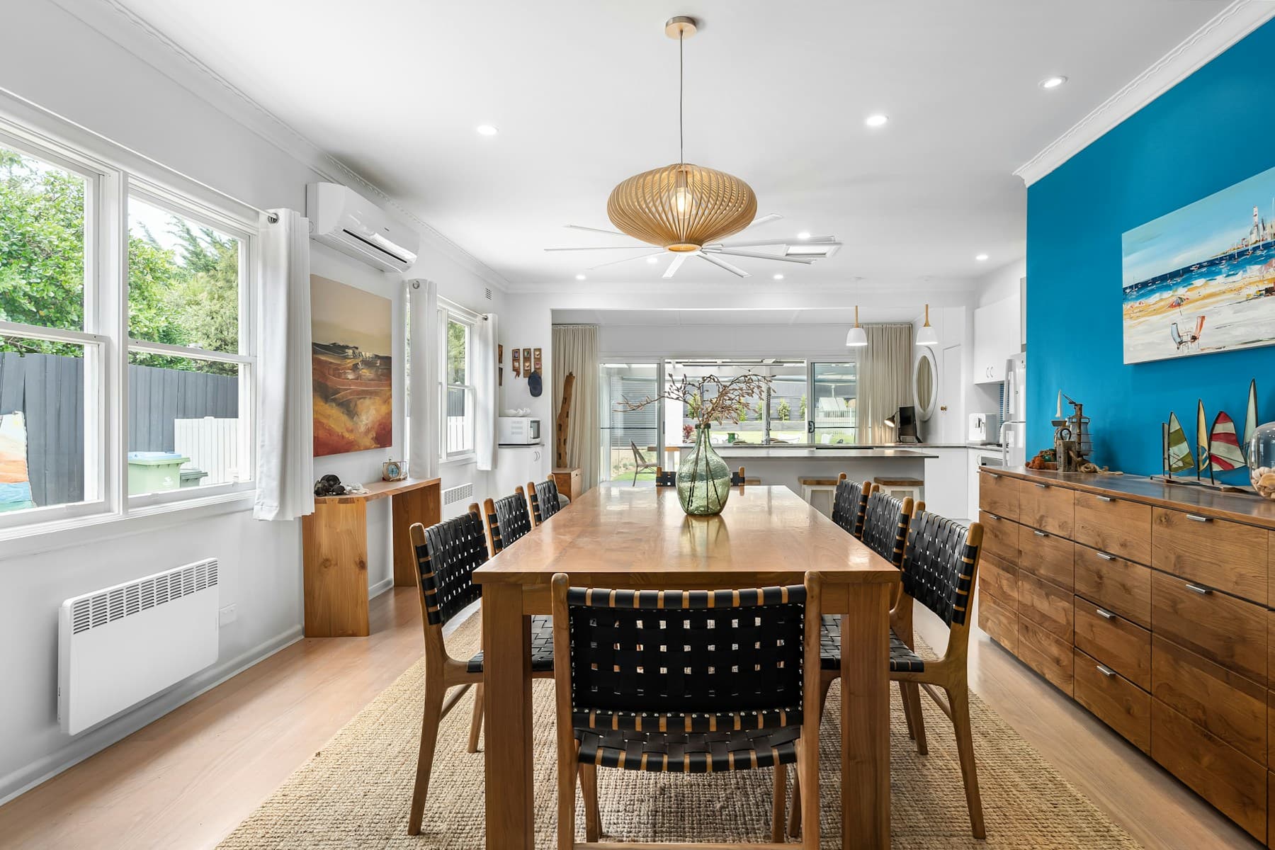 Dining room with serving storage and warm materials